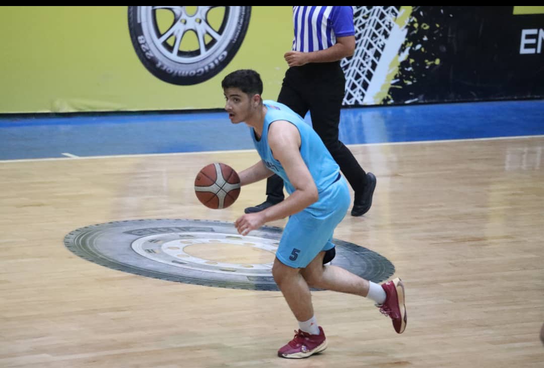 Arvin Aghajari moving the ball up the court in transition